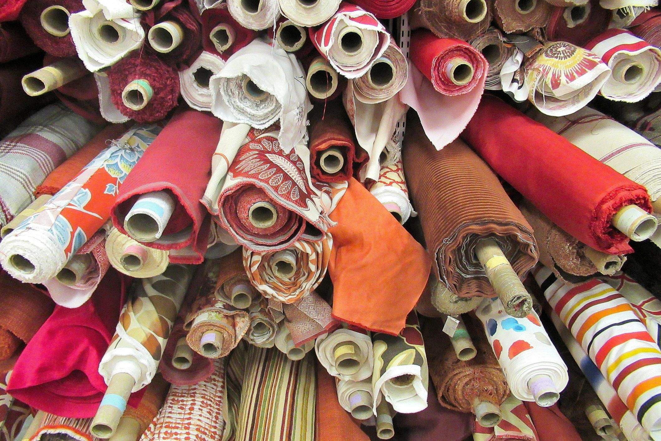 Bolts of colored fabric on display