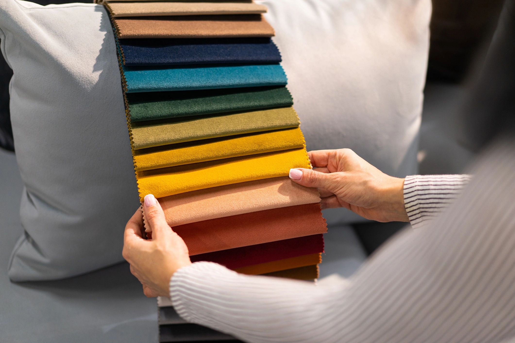 Customer reviewing fabric samples for upholstery