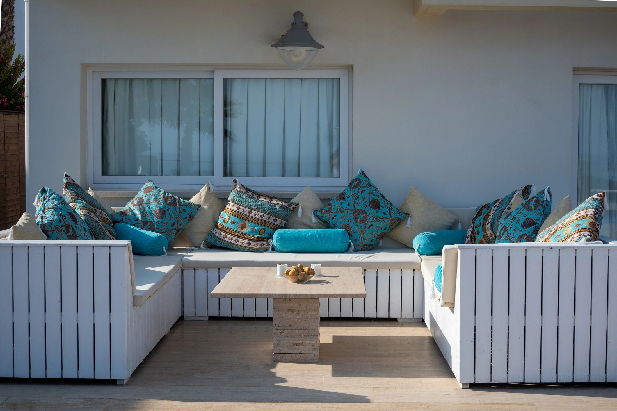 Patio furniture with turquoise outdoor cushions